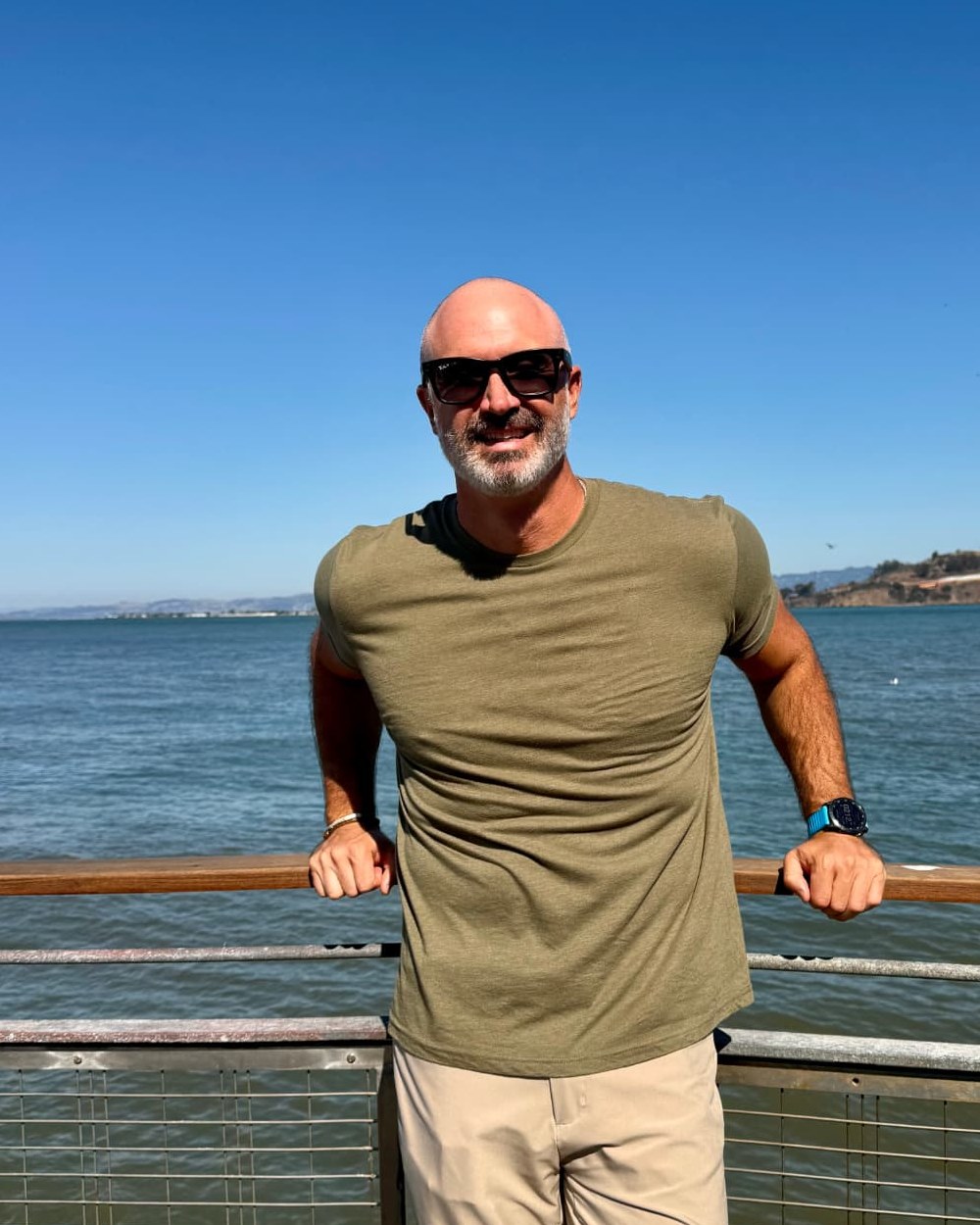 Matthew Loughran, EMBA, founder of NorCal Youth Pickleball Association, standing in front of the San Francisco Bay
